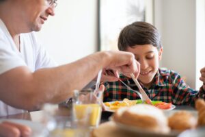 Father feeds his son